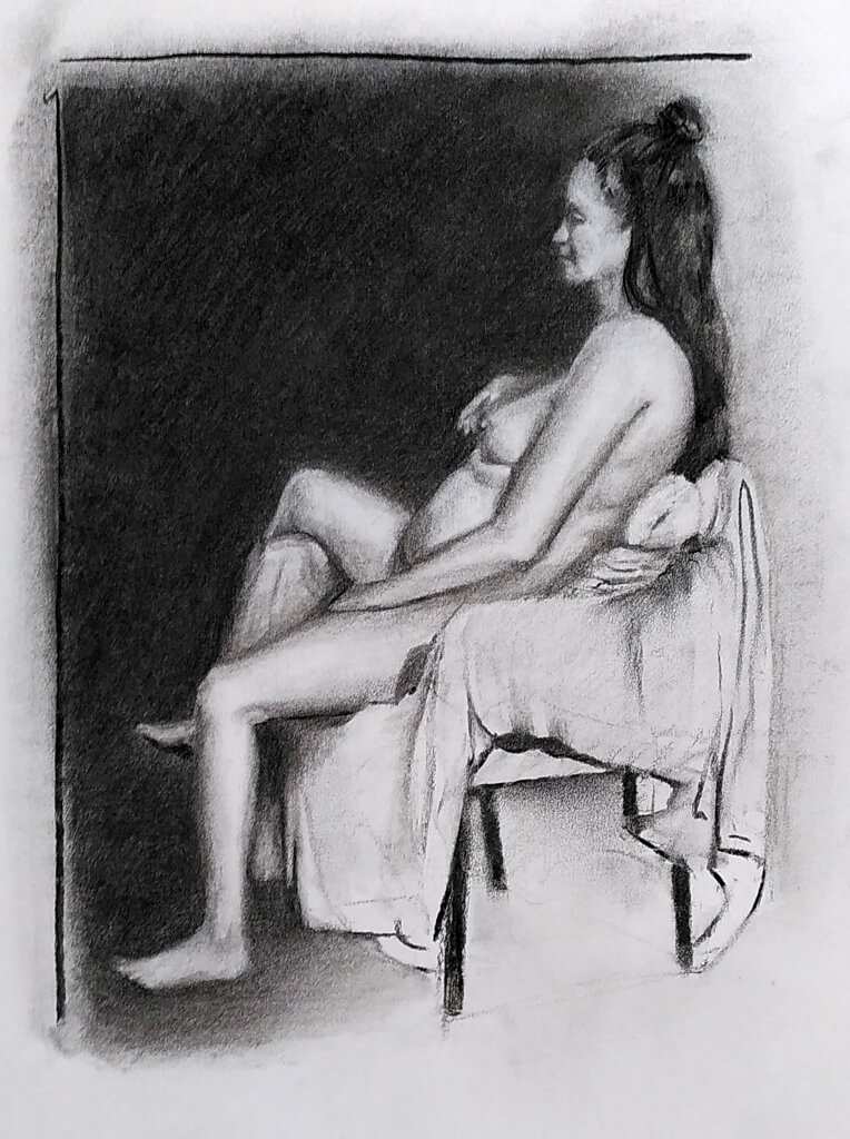 Charcoal nude of a seated woman.