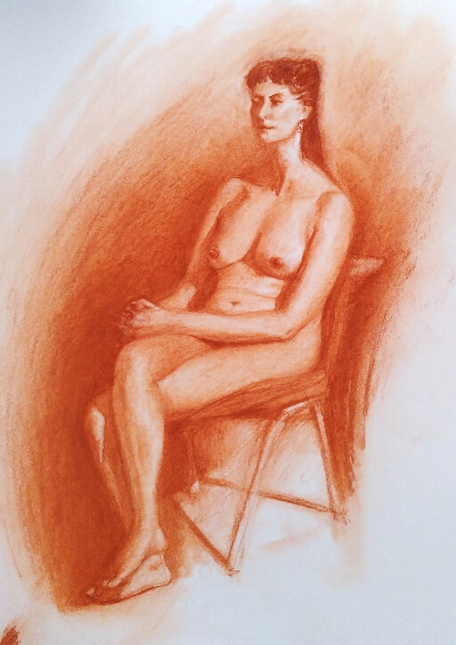 Red chalk nude of a seated woman.