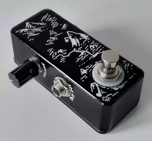 A small guitar pedal with a black and white map pattern, and one volume knob.