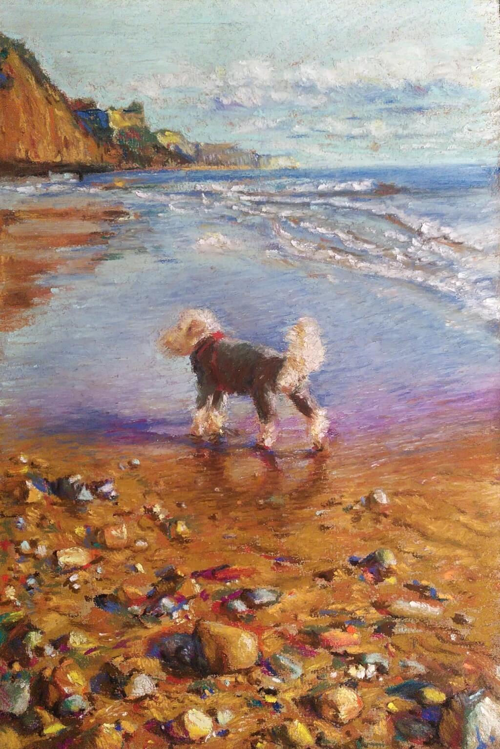 Coloured pastel drawing of a golden doodle in a grey fleece, on a sunlit beach.
